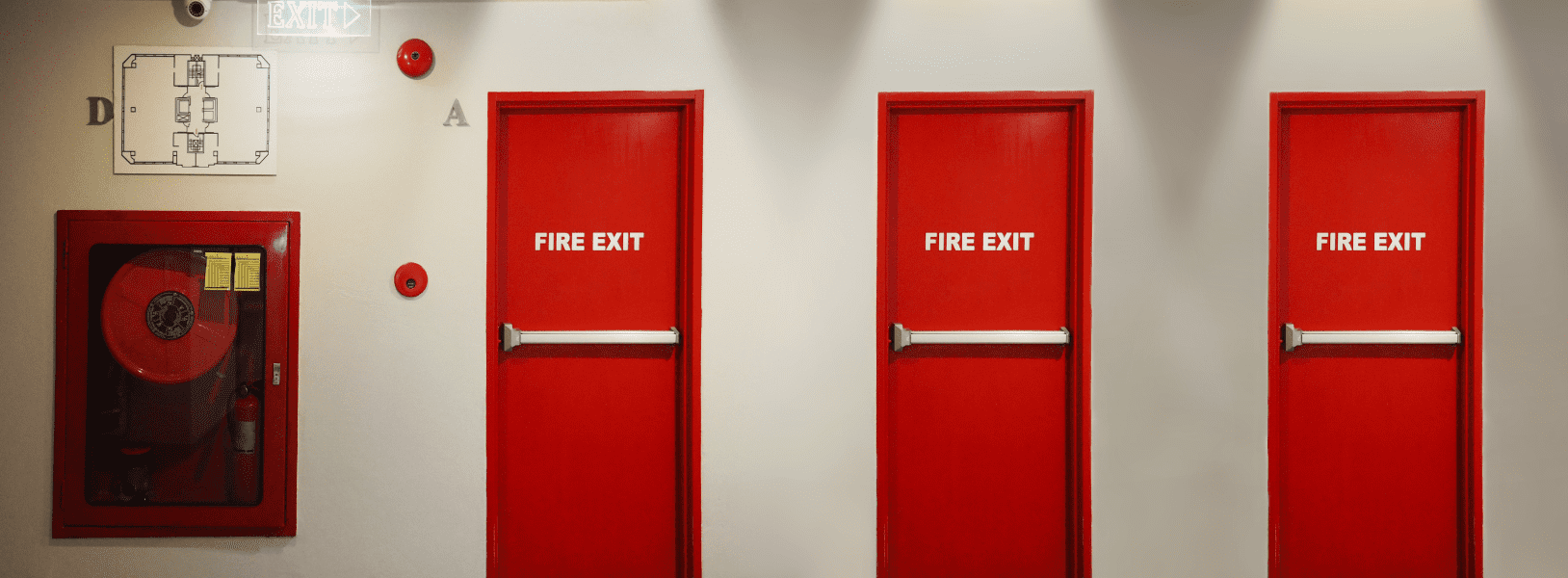 Red fire exit doors with panic hardware